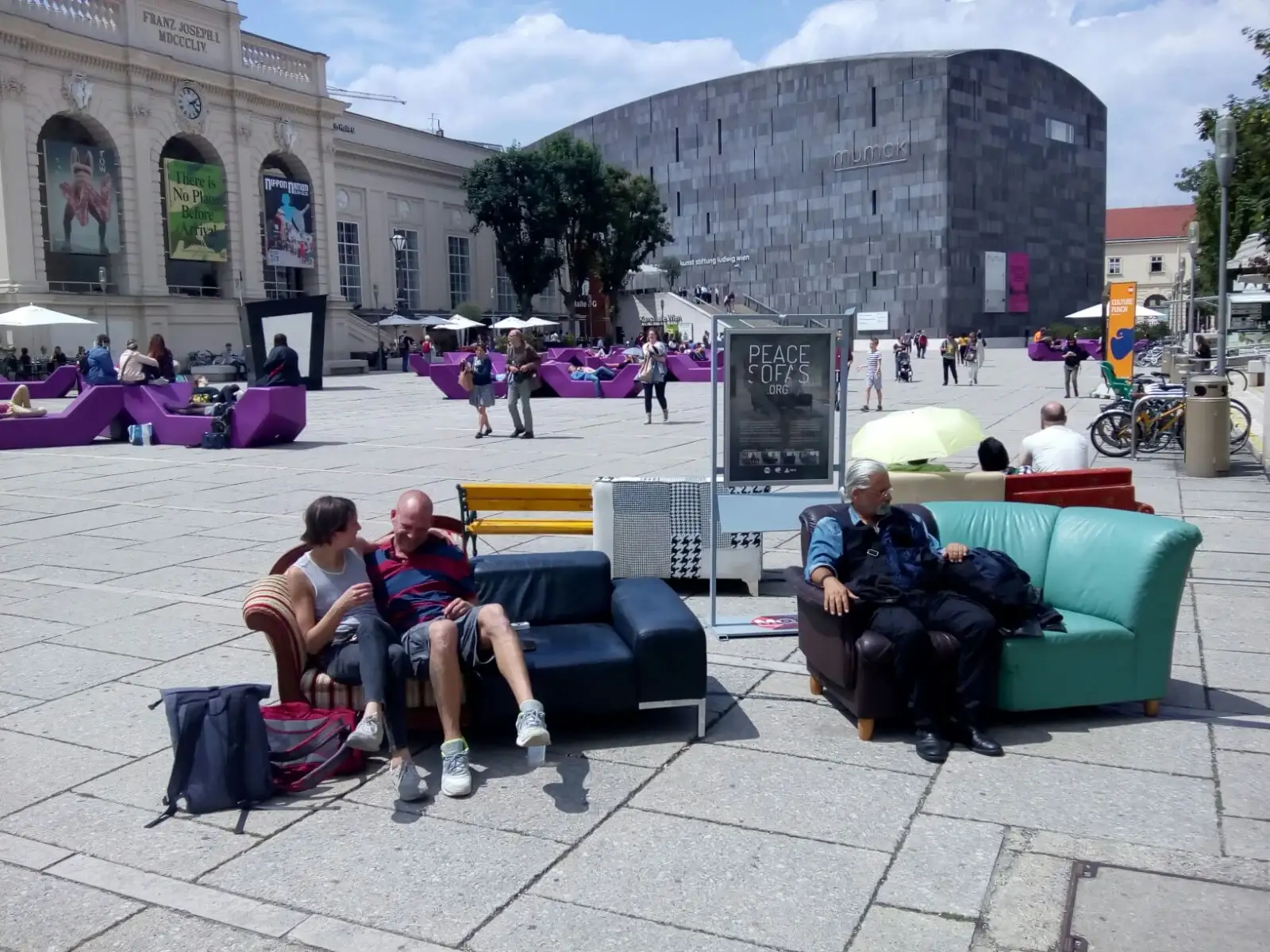 Visitors sitting on two merged Peace Sofas at the MuseumsQuartier Wien